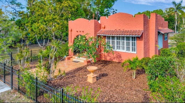 2002 Central Ave, Sarasota, FL 34234 - southwest-style home featuring stucco siding and a tiled roof