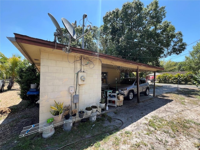 view of outbuilding with a carport