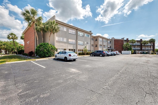 view of property featuring uncovered parking