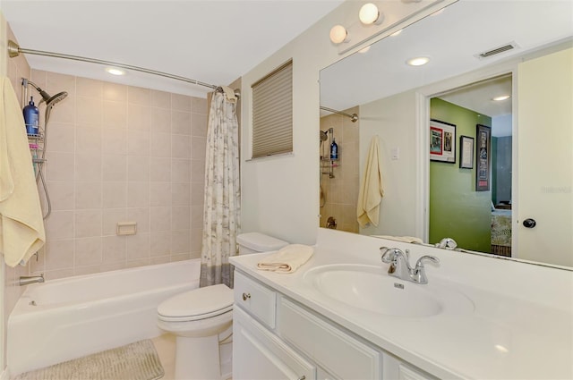 full bath featuring shower / bath combo, toilet, vanity, recessed lighting, and tile patterned floors