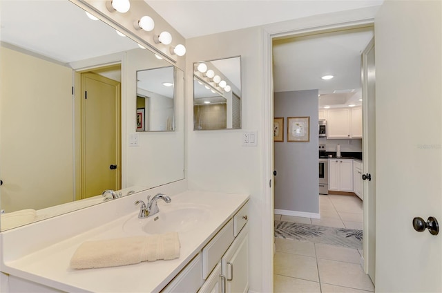 bathroom with tile patterned flooring and vanity