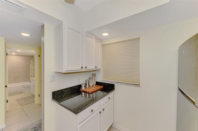 bar featuring light tile patterned floors, baseboards, and recessed lighting