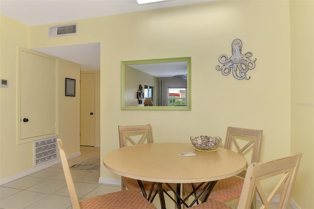 dining room featuring light tile patterned floors and baseboards