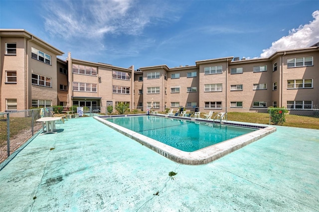 community pool featuring fence