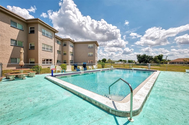 community pool featuring fence