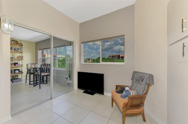 sitting room with tile patterned floors and baseboards