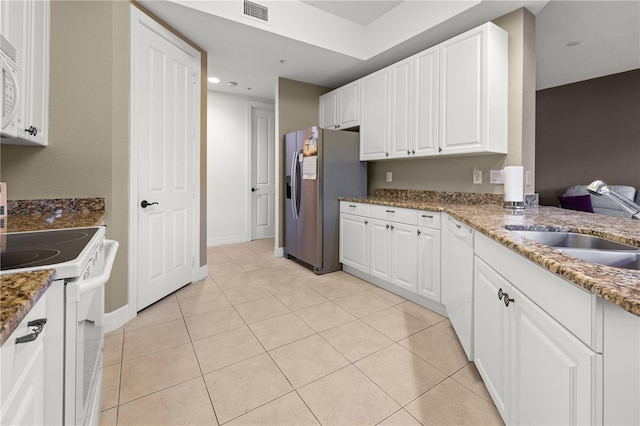 95 Vivante Blvd # 9524, Punta Gorda, FL 33950 - kitchen featuring visible vents, white appliances, white cabinetry, a sink, and stone counters