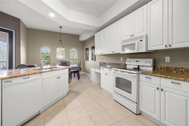95 Vivante Blvd # 9524, Punta Gorda, FL 33950 - kitchen with a sink, white cabinetry, light tile patterned floors, and white appliances