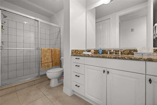 95 Vivante Blvd # 9524, Punta Gorda, FL 33950 - bathroom featuring toilet, a shower stall, tile patterned flooring, and vanity