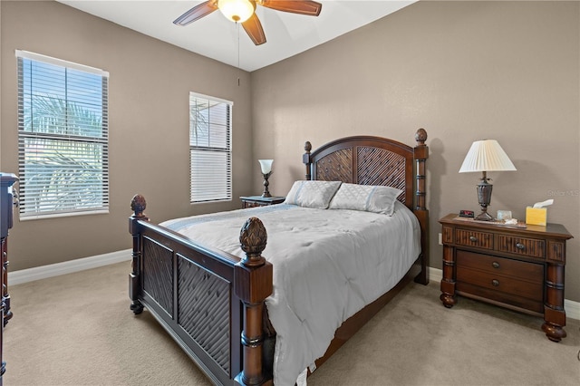 95 Vivante Blvd # 9524, Punta Gorda, FL 33950 - bedroom with baseboards, multiple windows, and light carpet