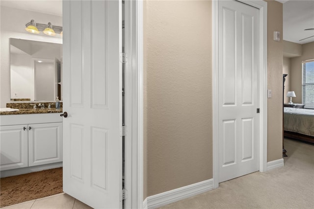 95 Vivante Blvd # 9524, Punta Gorda, FL 33950 - bathroom with vanity, baseboards, and ensuite bath