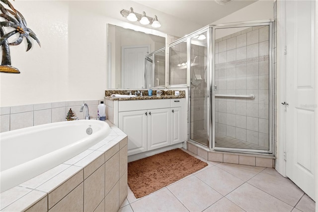 95 Vivante Blvd # 9524, Punta Gorda, FL 33950 - bathroom with vanity, a stall shower, tile patterned floors, and a garden tub