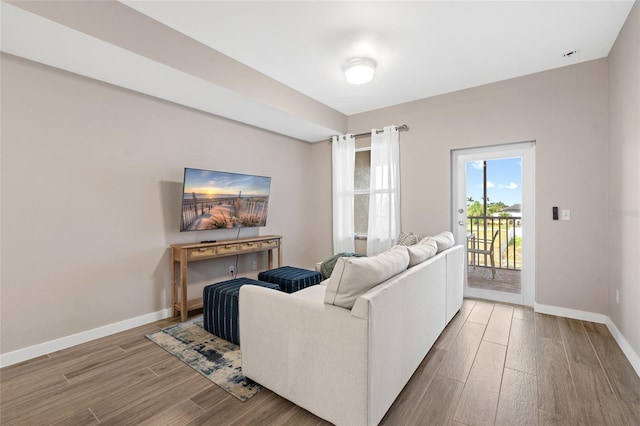 living room with wood finished floors and baseboards
