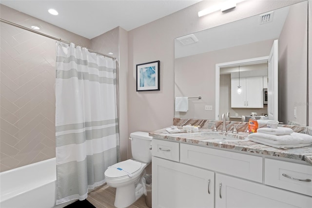bathroom with toilet, vanity, shower / bath combo with shower curtain, wood finished floors, and recessed lighting