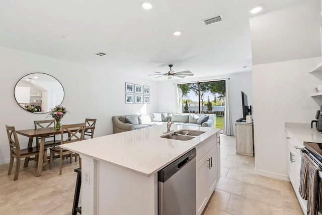 kitchen with electric range, ceiling fan, a sink, stainless steel dishwasher, and visible vents