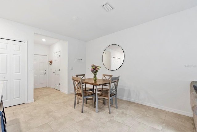 dining space with baseboards, recessed lighting, and visible vents