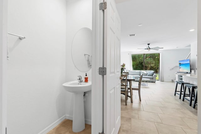 bathroom with a sink, tile patterned floors, a ceiling fan, baseboards, and recessed lighting