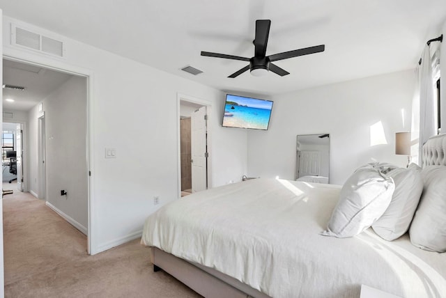 bedroom with baseboards, visible vents, light carpet, and ceiling fan