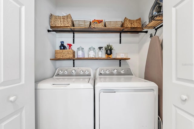 laundry area featuring laundry area and washing machine and clothes dryer