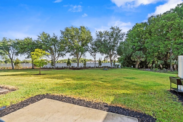 view of yard with fence and a patio area