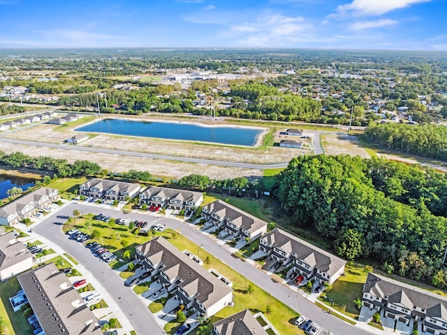 birds eye view of property with a water view and a residential view