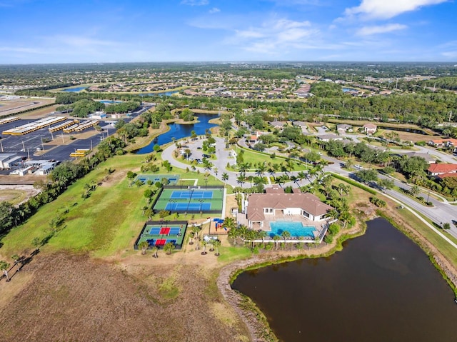 birds eye view of property with a water view