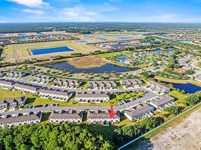 aerial view featuring a water view and a residential view