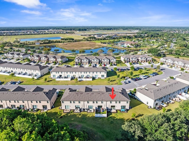 bird's eye view with a residential view and a water view