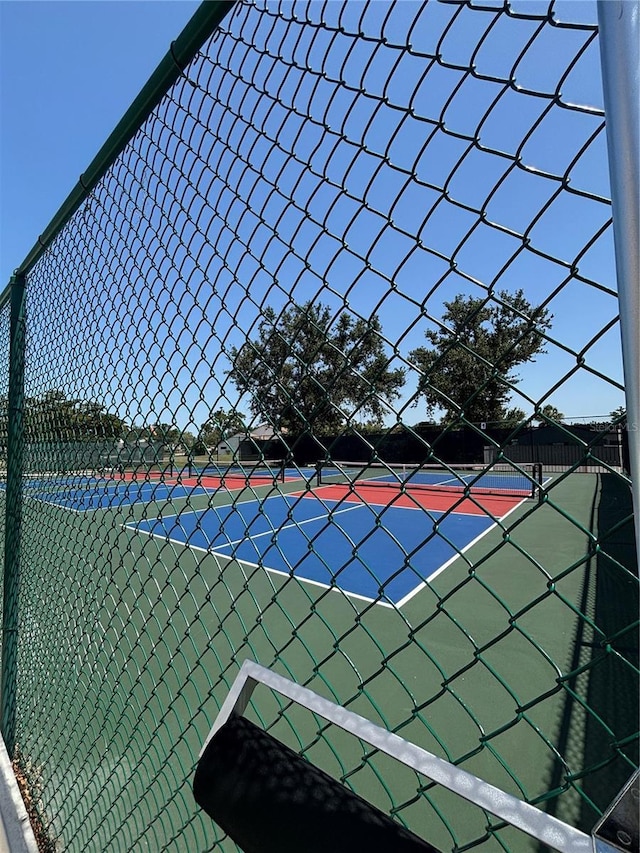 618 Bird Bay Dr S Unit 109, Venice, FL 34285 - view of tennis court with fence