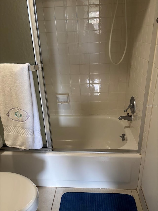 618 Bird Bay Dr S Unit 109, Venice, FL 34285 - bathroom with tile patterned floors, washtub / shower combination, and toilet