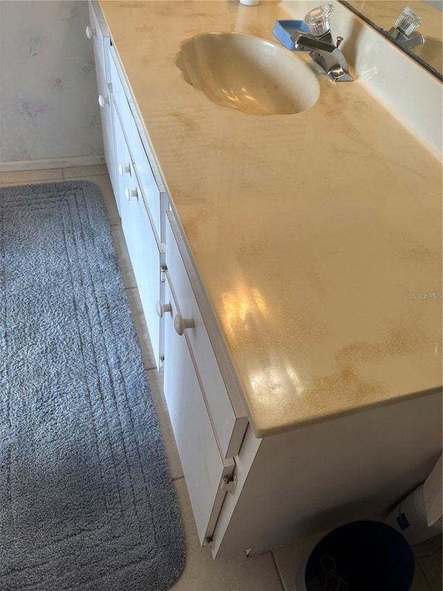 618 Bird Bay Dr S Unit 109, Venice, FL 34285 - bathroom featuring vanity, tile patterned floors, and baseboards
