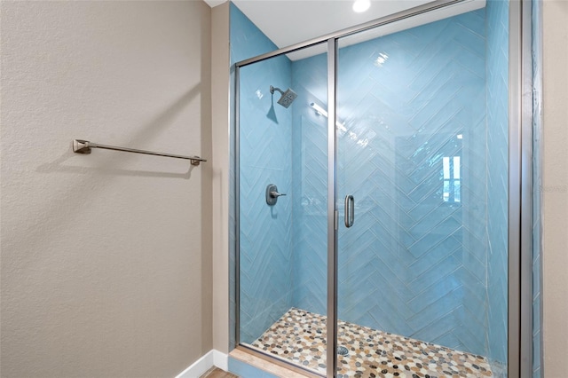 bathroom with a stall shower