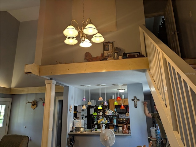 interior details featuring an inviting chandelier