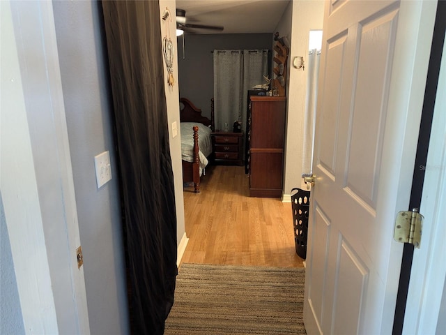 corridor with wood finished floors