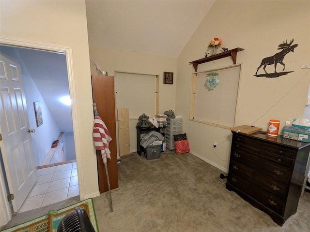 interior space with baseboards and vaulted ceiling