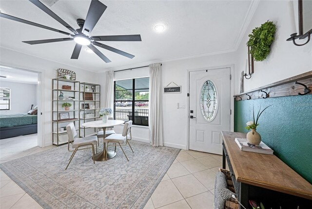 1741 NE Trisha Dr, Arcadia, FL 34266 - dining room featuring light tile patterned floors, ornamental molding, ceiling fan, and baseboards