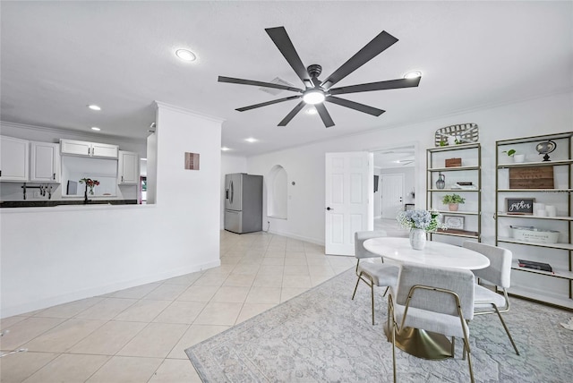 1741 NE Trisha Dr, Arcadia, FL 34266 - dining space with a ceiling fan, baseboards, recessed lighting, arched walkways, and light tile patterned flooring