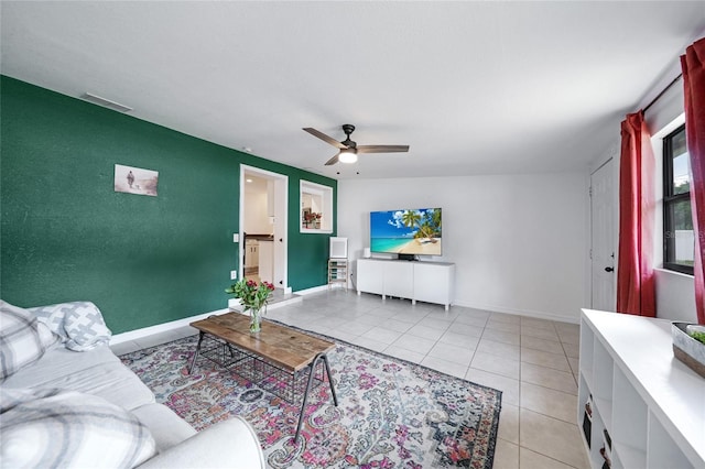 1741 NE Trisha Dr, Arcadia, FL 34266 - living area with ceiling fan, light tile patterned floors, and baseboards