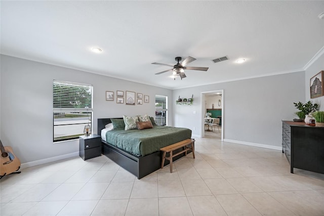1741 NE Trisha Dr, Arcadia, FL 34266 - bedroom featuring ornamental molding, baseboards, ceiling fan, and light tile patterned floors