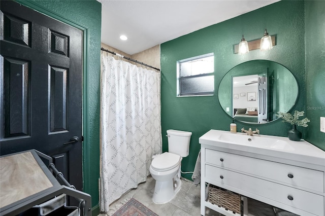 1741 NE Trisha Dr, Arcadia, FL 34266 - full bathroom featuring vanity, a textured wall, toilet, tile patterned flooring, and a shower with curtain