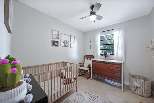 1741 NE Trisha Dr, Arcadia, FL 34266 - bedroom featuring light tile patterned floors, a nursery area, and ceiling fan