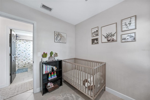 1741 NE Trisha Dr, Arcadia, FL 34266 - tiled bedroom with a nursery area and baseboards