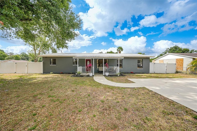 1741 NE Trisha Dr, Arcadia, FL 34266 - single story home featuring a gate, covered porch, and metal roof