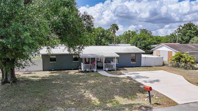 1741 NE Trisha Dr, Arcadia, FL 34266 - ranch-style house featuring a porch and metal roof