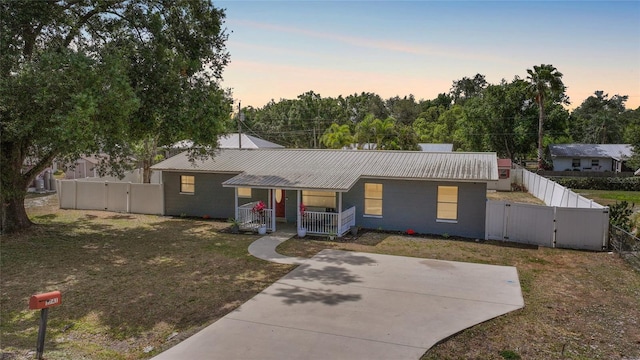 1741 NE Trisha Dr, Arcadia, FL 34266 - ranch-style home featuring a gate, a porch, and metal roof