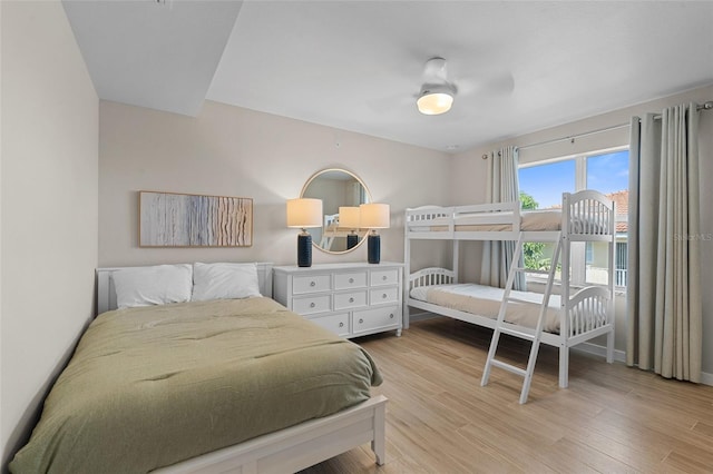 bedroom featuring light wood-type flooring and baseboards