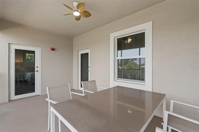 view of patio featuring ceiling fan and outdoor dining space