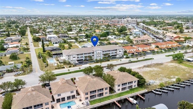 aerial view of residential area with a large body of water
