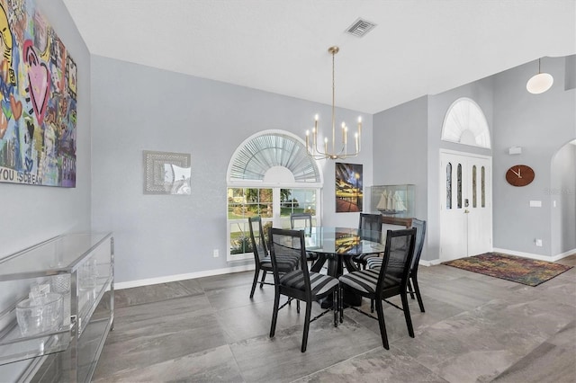 3520 Caya Largo Ct, Punta Gorda, FL 33950 - dining space featuring visible vents, baseboards, a high ceiling, and an inviting chandelier