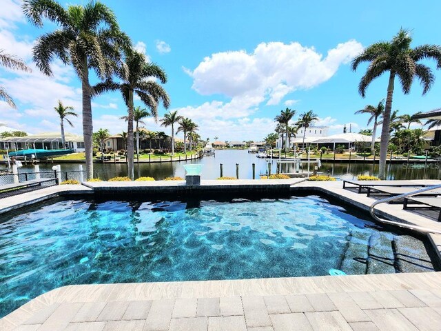 3520 Caya Largo Ct, Punta Gorda, FL 33950 - view of swimming pool featuring a water view and a dock